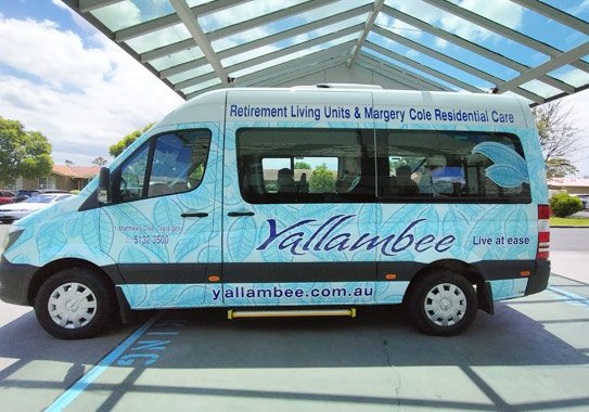 Photo of the Yallambee Aged Care mini bus with signage wrap on it.